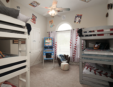 triple bunks in this baseball-themed bedroom at a luxury home for rent in Central Florida near Orlando & Disney
