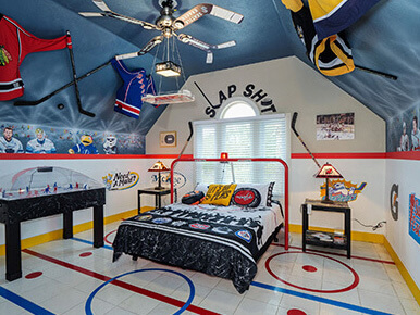 ice hockey themed bedroom with goal bed and hockey ceiling fan